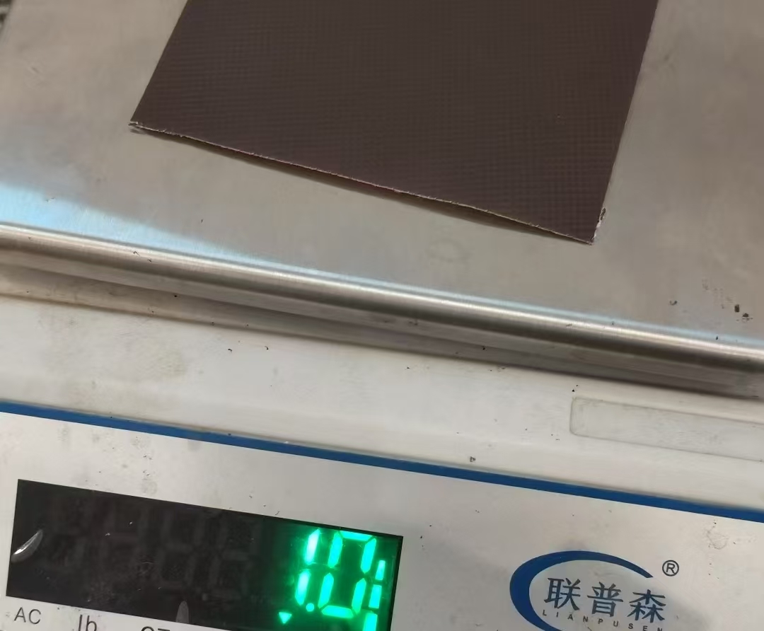 Fabric cutting and weighing on digital scale